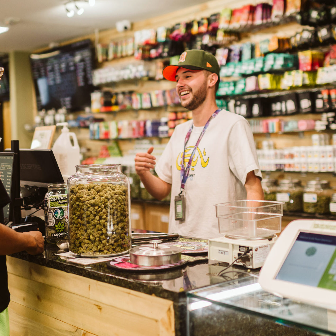 Life Flower Budtender Having a Conversation with a Customer